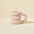 Blume Pink Cloud Mug on a beige countertop