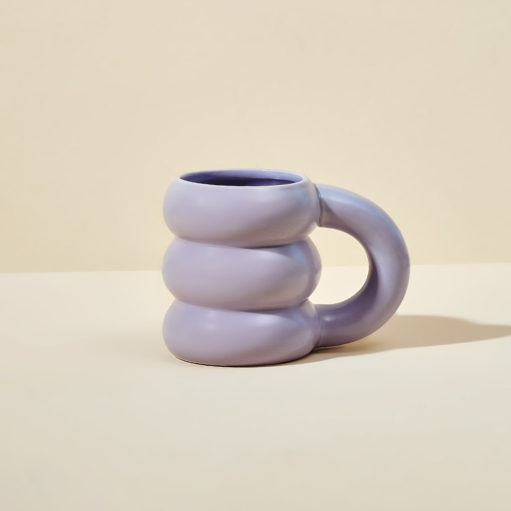 Blume Purple Cloud Mug on a beige countertop
