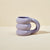 Blume Purple Cloud Mug on a beige countertop