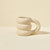 Blume Tan Cloud Mug on a beige countertop