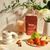 Lattes made with Blume Superfood Oat Milk Chai Blend, surrounded by flowers and fruits on a countertop