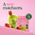 Blume Strawberry Matcha Superfood Powder pouch with an iced latte and strawberries on a pink background