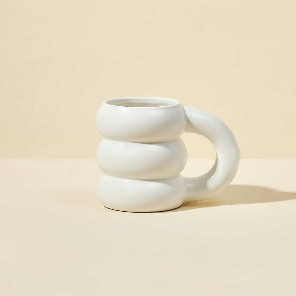 Blume White Cloud Mug on a beige countertop