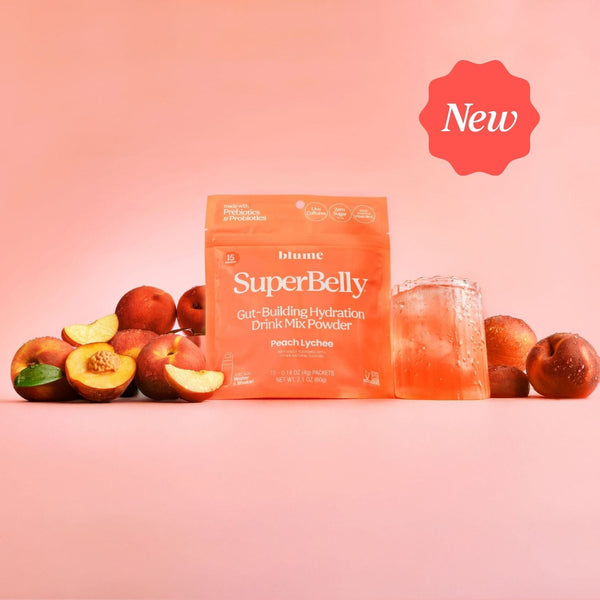 Blume SuperBelly Peach Lychee Gut-Building Hydration Powder package with peaches on a pink background